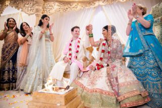 Bride and groom getting married at Oshwal Centre