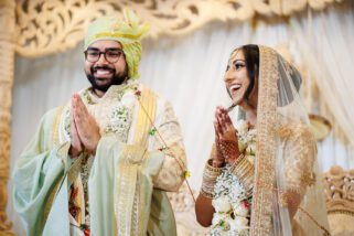 Asian Bride and groom laughing