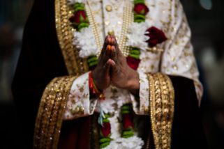Wedding Groom's hands in prayer position