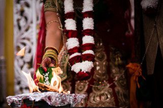 Seeds being poured into the fire during Hindu Weddnig