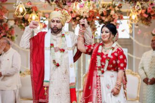 Asian wedding bride and groom smiling