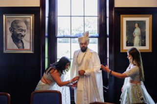 Asian groom getting ready