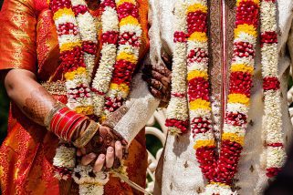 Bride and groom holding hands