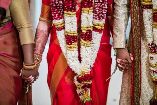 Closeup of bride holding hands